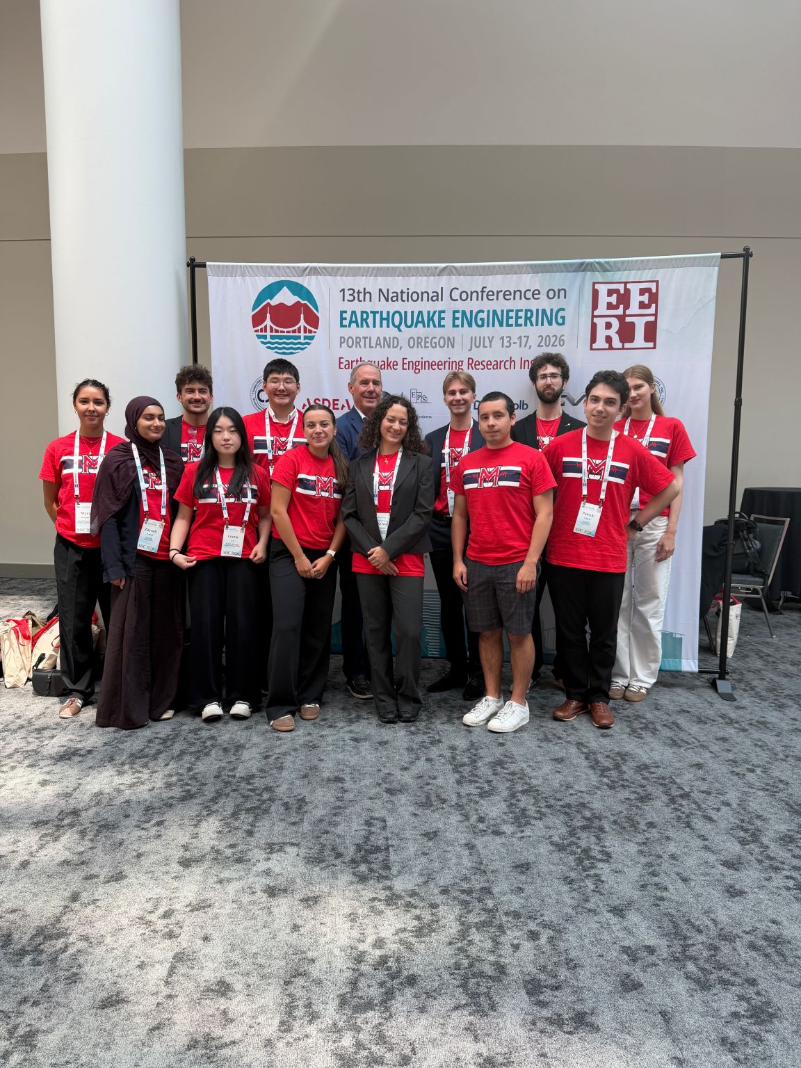 Team at the 13NCEE EERI banner in Portland